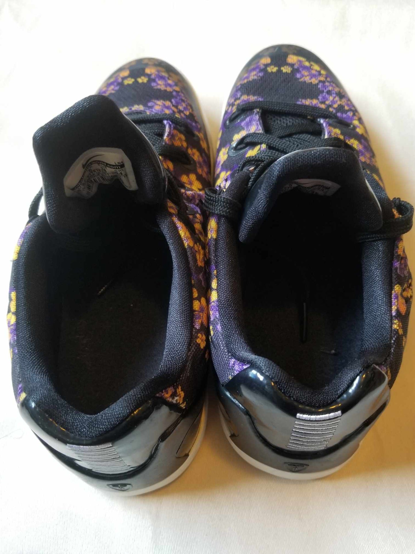 Nike Kobe Bryant "9 em floral" size 5.5y Big Kids/Women. Color black,yellow, and purple. PRE-OWNED