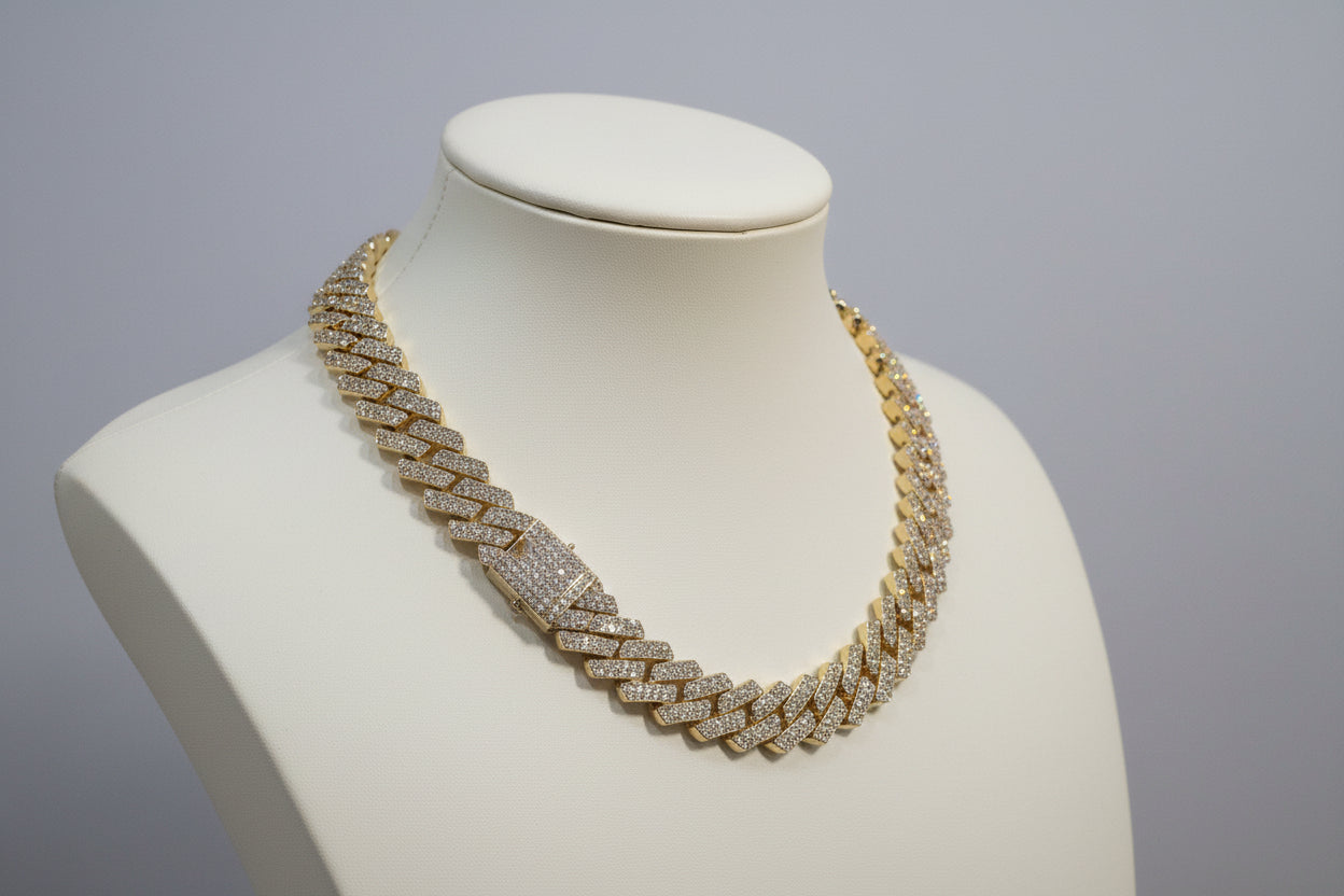 20mm "Iced Out" Cuban Link Chain: A bold 18-inch necklace featuring gold over copper and VVS CZ stones