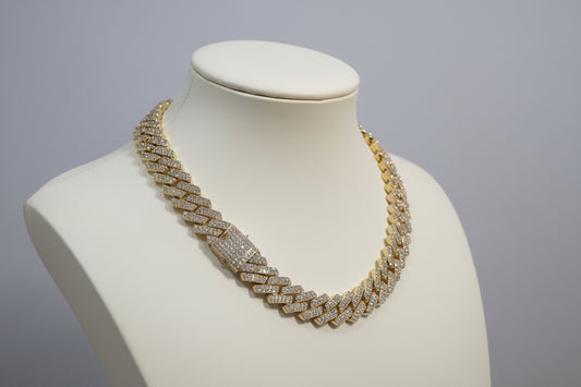 20mm "Iced Out" Cuban Link Chain: A bold 18-inch necklace featuring gold over copper and VVS CZ stones
